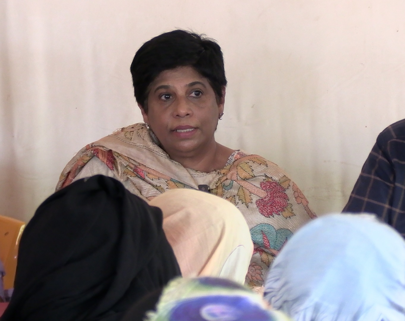 ICC Deputy Prosecutor Nazhat Shameem Khan speaking with victims who fled Sudan. Photo: ICC-CPI