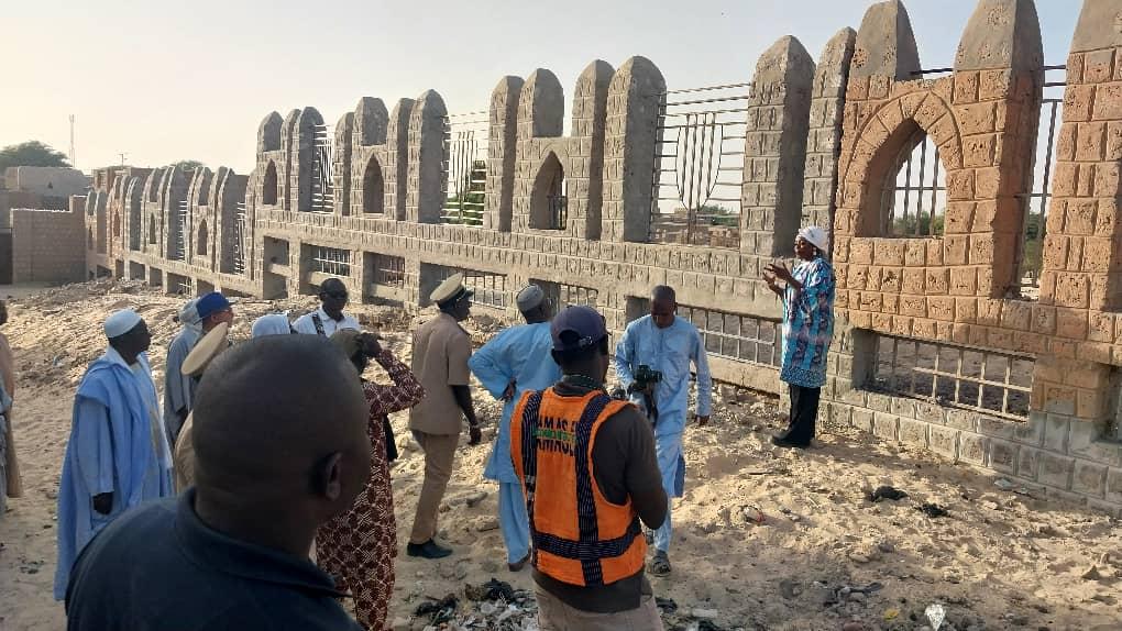 Rehabilitation of a fence of a cemetery hosting destroyed historic mausoleums in Timbuktu addressing the war crime of attacks against protected religious and historic buildings. Credit:  UNESCO- Modibo Bagayoko / 2022